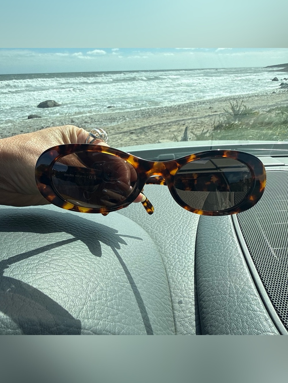 Miu Miu Tortoiseshell Oval Sunglasses with Dark Brown Lenses